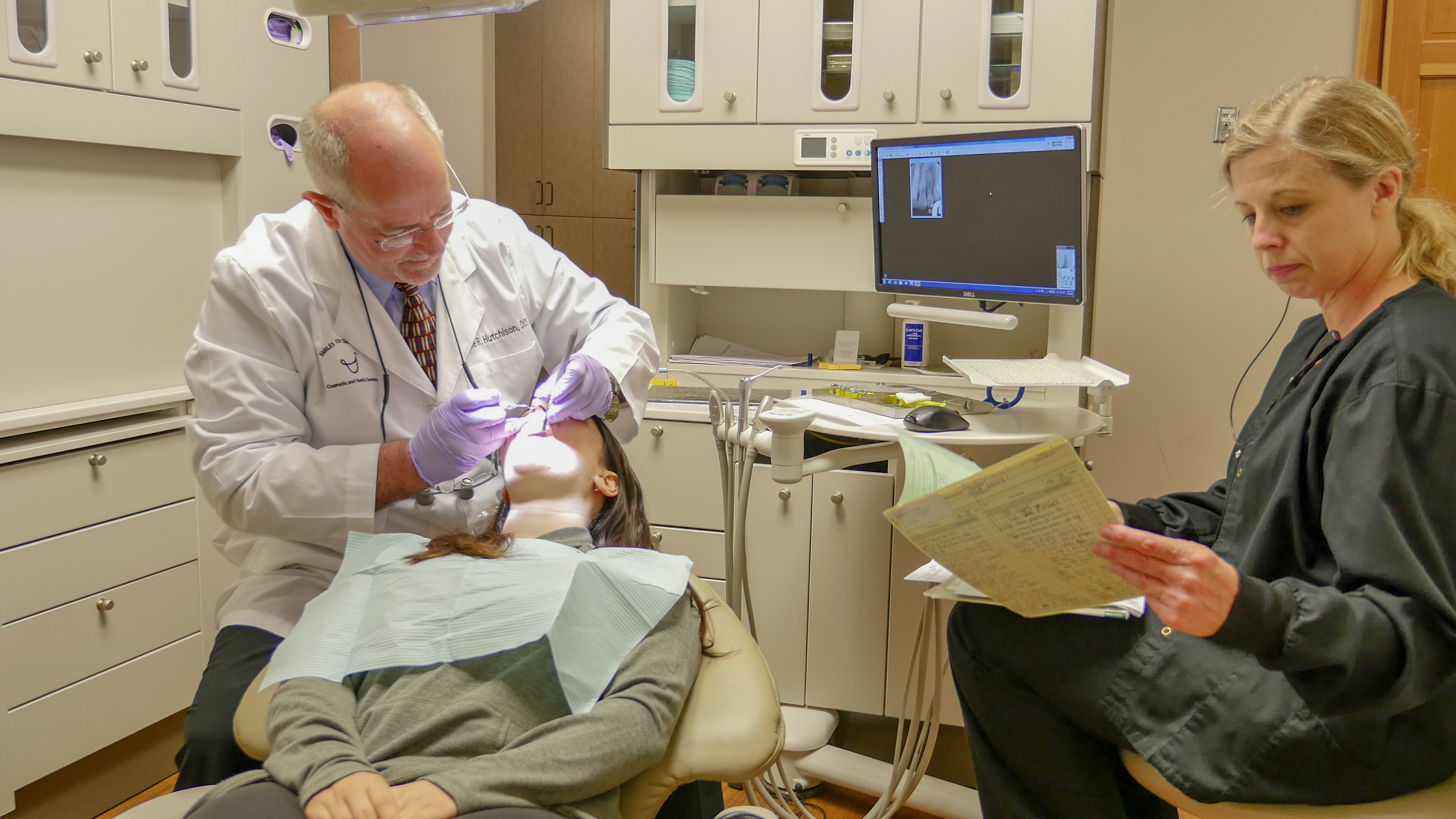 Dentist performing a dental bridge