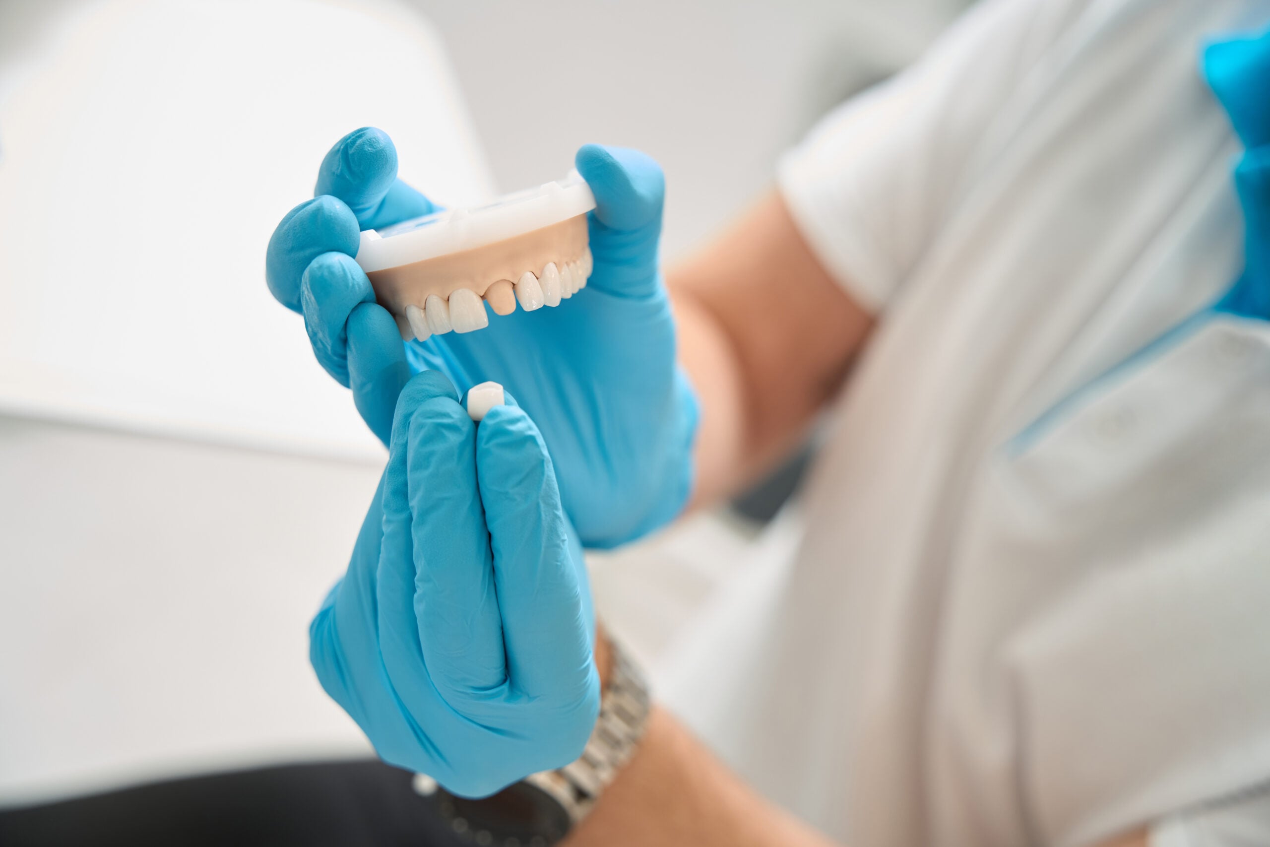 Orthodontist showing a dental crown
