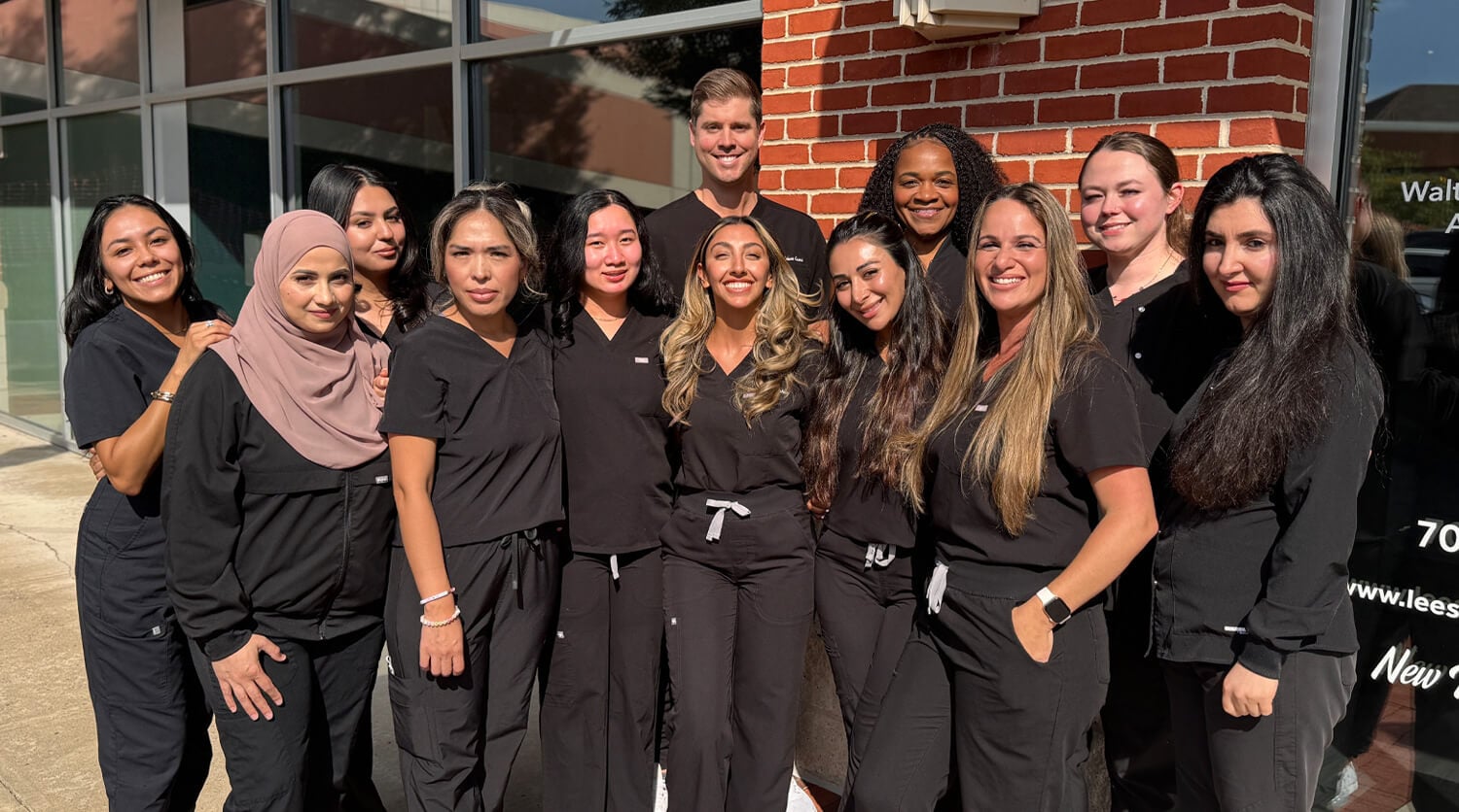 Leesburg Family Smiles Staff Photo Outside of Practice